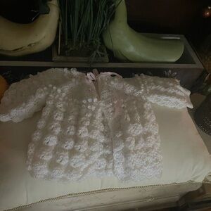Handmade White Crochet Baby Sweater with Pink and Green Floral Accents